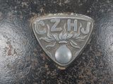 a close up of a metal object with a logo on it