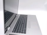 a close up of a laptop computer on a white surface