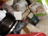 a pile of food that includes a coffee maker, a tea kettle, and other items