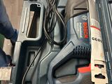 an image of a corded drill in a tool box