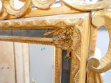 a mirror that is sitting on a table in front of a wall