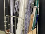 a metal cart with rolls of wrapping on top of it