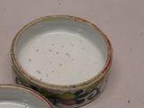 two bowls of milk sitting on a table next to each other