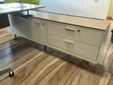 an image of a desk with a computer on top of it