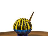 a yellow and black animal figurine sitting on a table