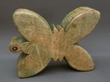 sculpture of a butterfly made of green clay with a brown eye