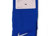 a pair of blue socks with the nike classic logo on them