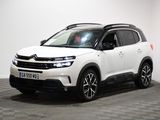 the white citrole suv is parked in a white room