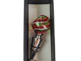 bottle stopper in a black box with a red and green swirl design