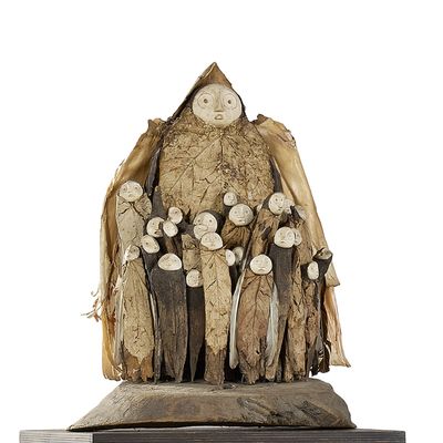 a statue of a man with a group of people on it