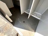 a small bathroom with a toilet and a shower stall