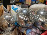 three disco balls that are sitting in a box