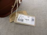 a brown bag with a price tag on it sitting on a table