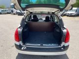 the back of a car with its trunk open in a parking lot