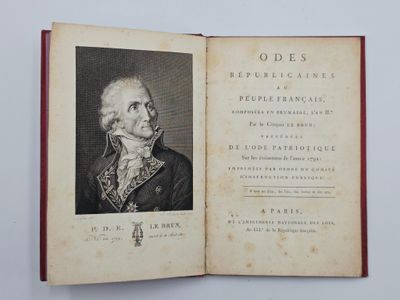 un livre ouvert avec la photo d'un homme en costume-cravate