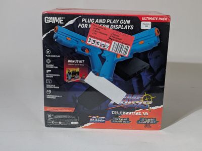 a toy gun that is in the box on the table