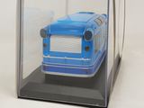 a blue bus in a clear box on a white surface