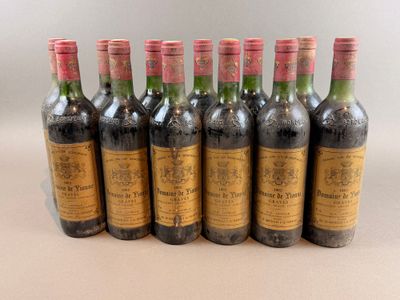 six bottles of wine lined up in a row on a table