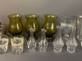 many different glass vases sitting on a table