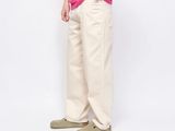 a picture of a man in a pink shirt and khaki pants