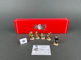 a red box that has some small toy soldiers in it