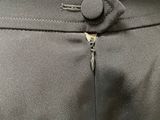 a close up of the zippers on the pants of a woman ' s dress