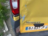 a yellow van that has been damaged and is parked on the side of the road