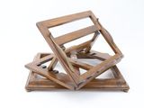 three pieces of wood are stacked on top of each other