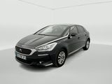 a black car in a white room with a white background