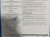 an image of a document with a picture of a person holding a cell phone