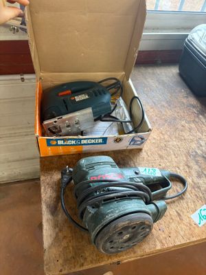 a box with a sander and a sander on a table