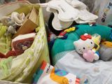 many stuffed animals and toys in a bag on the floor