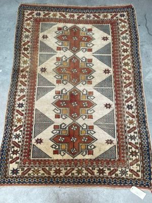 a rug with a pattern on it sitting on a floor