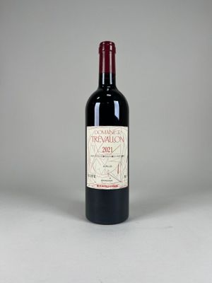 the bottle of red wine is sitting on the table