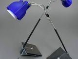 pair of blue desk lamps on a metal stand with a laptop