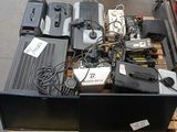 a lot of electronics on a pallet in a warehouse