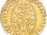 a close up of a gold coin with an image of a woman on it