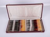 a case with a set of knives and knives in it