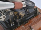 an old sewing machine that is sitting on top of a wooden box
