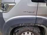 a car that has been left on the side of the road with mud all over it