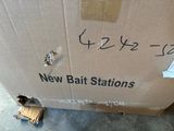 a box that has a sign on it that says new bait stations