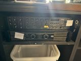 a radio that is sitting on top of a trash can