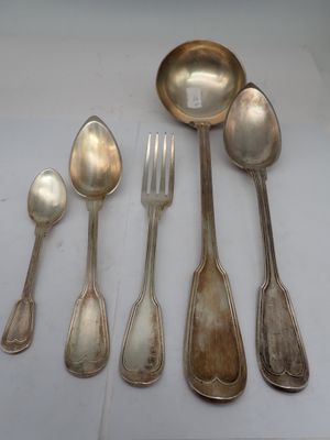 five spoons and a fork sitting on a table