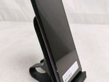 a cell phone that is sitting on a stand