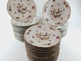 many plates stacked on top of each other on a table