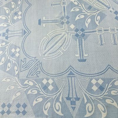 an image of a blue and white table cloth with a cross on it