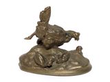a bronze statue of a pheasant on top of a rock