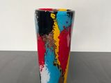 an image of a colorful cup sitting on a table