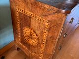 a wooden chest with a decorative design on it