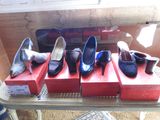 several pairs of women ' s shoes are on display on a table